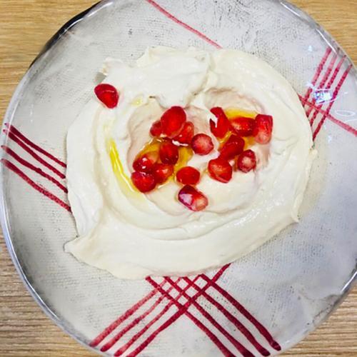 Lebanese Mezze labneh with pomegranate and olive oil